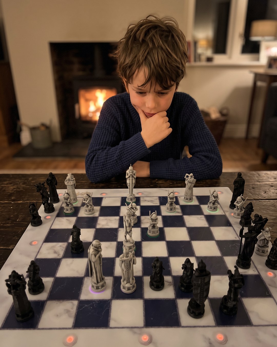 GoChess Wizard, Boy · fireplace · thinking